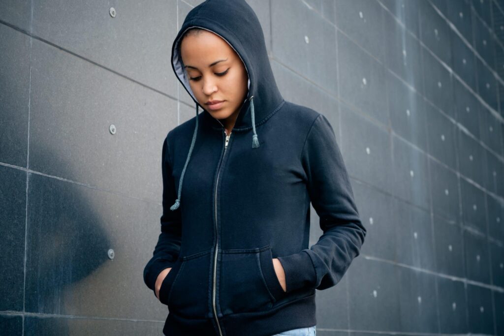 Dress up a hoodie with athletic leggings and sneakers for a stylish athleisure outfit